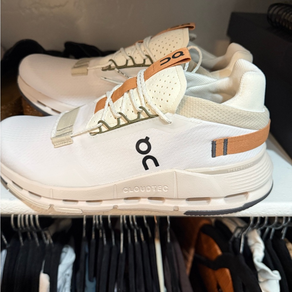 On Running White and Orange Sneakers with Cloudtec Cushioning